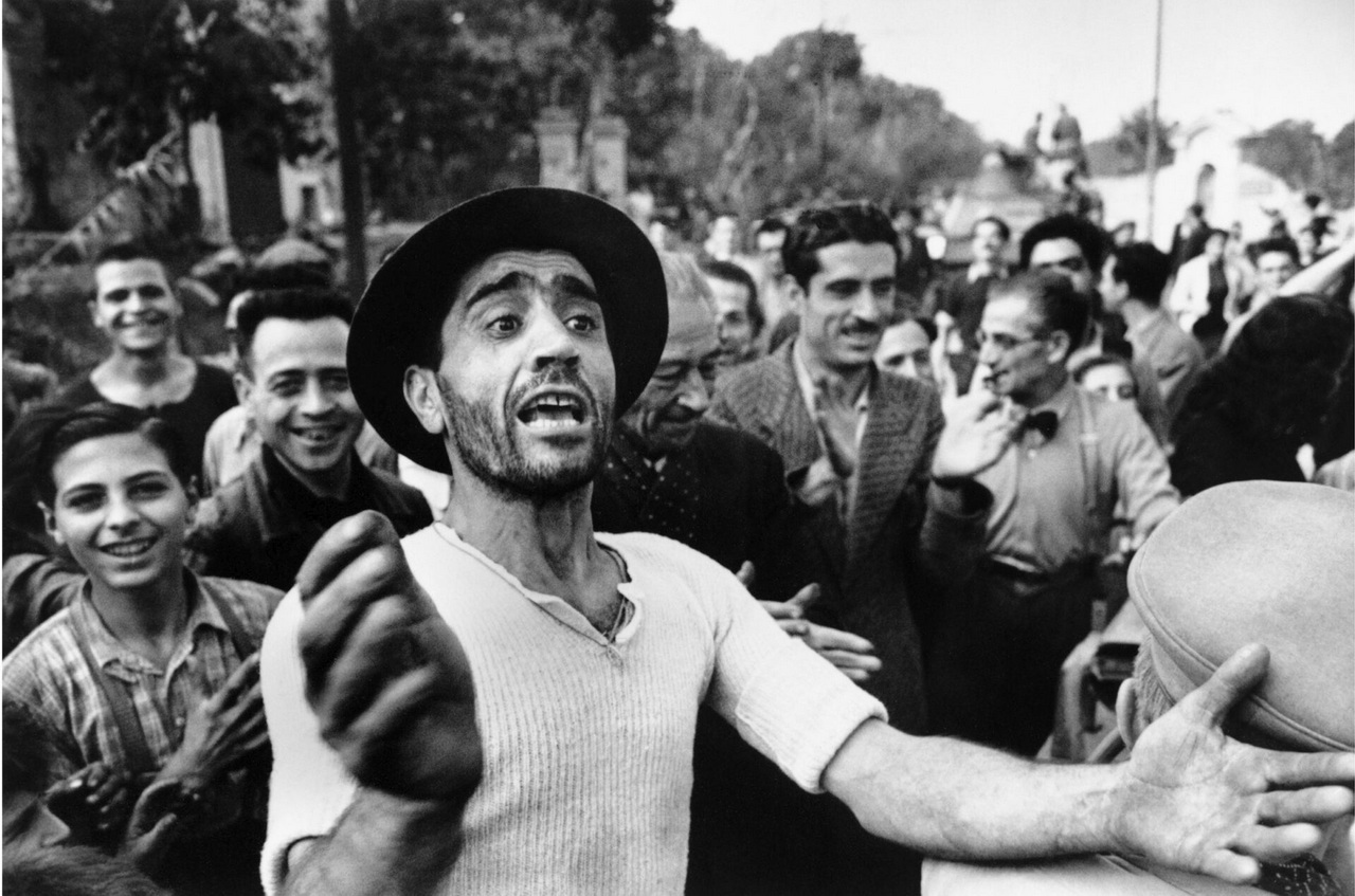 Robert Capa, [Crowds greeting American troops upon entering Monreale, on the outskirts of Palermo, Sicily], July 1943. Collection International Center of Photography, New York, Credit ICP/Magnum Photos